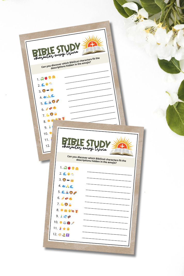 flatlay of two printable bible character emoji game sheets on a white table with white flowers