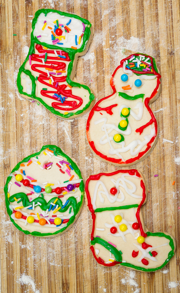 soft and chewy christmas cookies in fun shapes like snowman, christmas stocking, christmas ornament